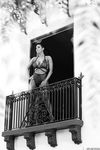Hypnotizing brunette Sunny Leone in exciting black lingerie on the balcony