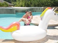 Blonde teen Lady Bug bares tiny titties to catch a load in her mouth poolside