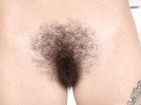 Solo girl Sweet Mary Jane puts her natural beaver on display in solo action