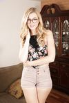 Nerdy blonde teen Alexa Grace wiggles her hips as she strips naked