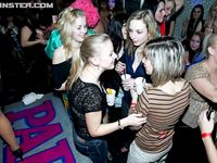 Horny sluts get on their knees for stripper cock at interracial club orgy