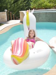 Blonde teen Lady Bug bares tiny titties to catch a load in her mouth poolside