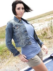 Busty babe Dylan Ryder takes off her clothes and showcases her big boobs